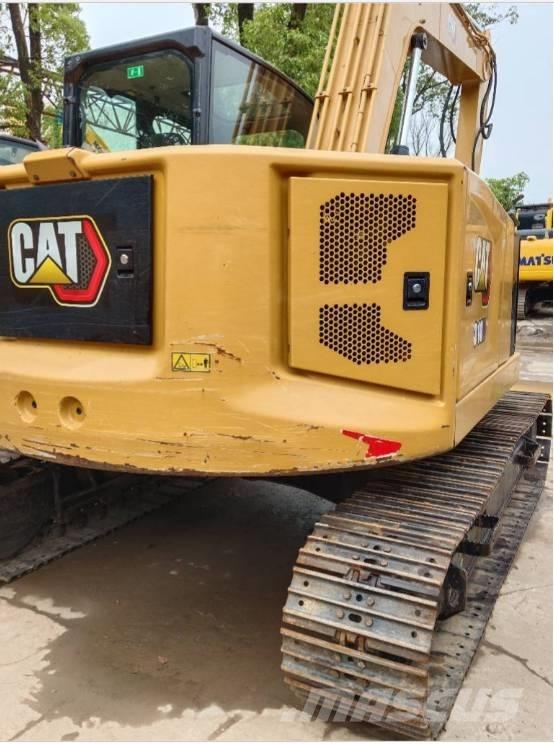 CAT 310 Telakaivukoneet