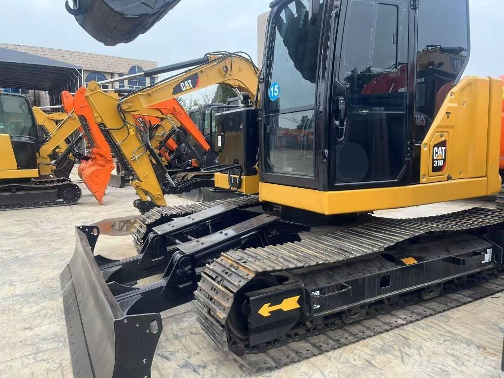 CAT 310 Telakaivukoneet