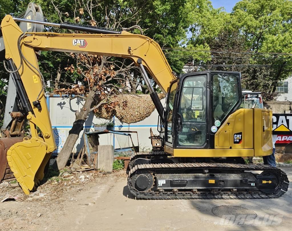 CAT 310 Telakaivukoneet