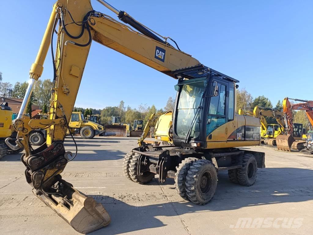 CAT M 318 C Pyöräkaivukoneet