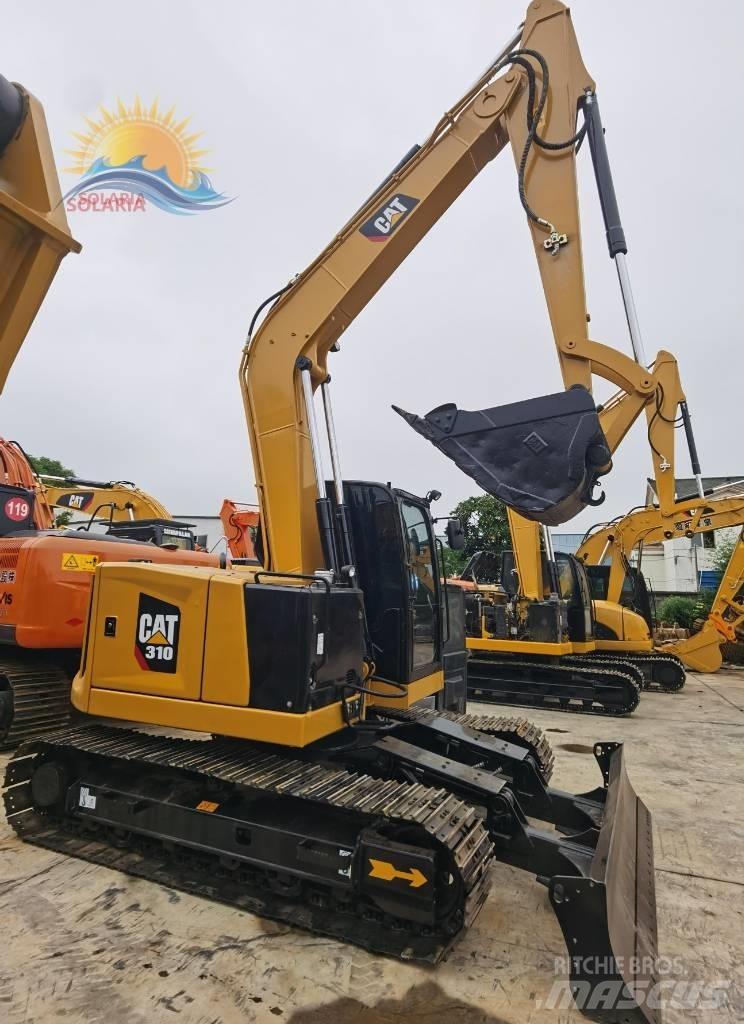 CAT 310 Telakaivukoneet