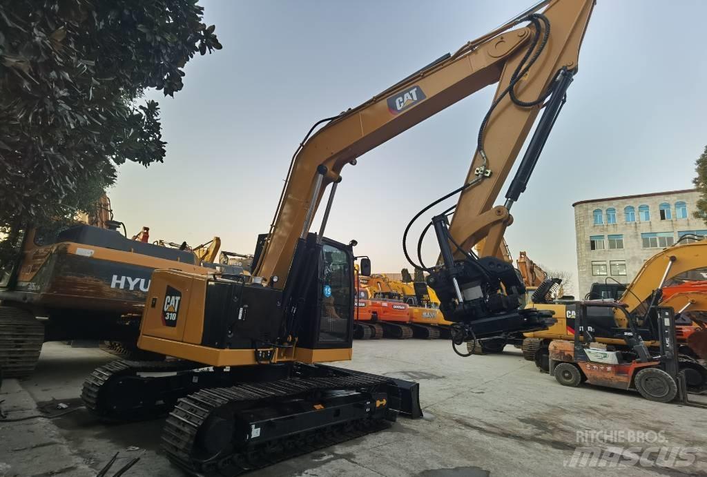 CAT 310 Telakaivukoneet