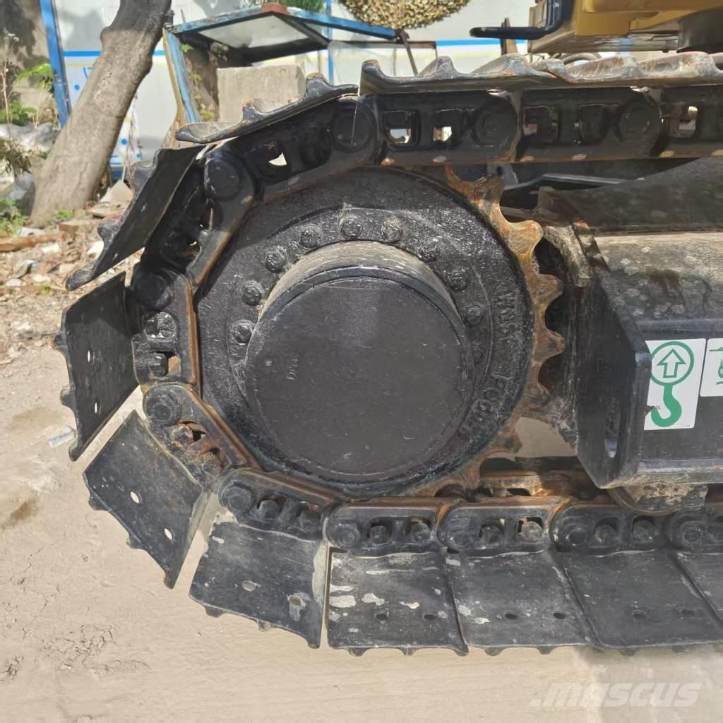 CAT 310 Telakaivukoneet