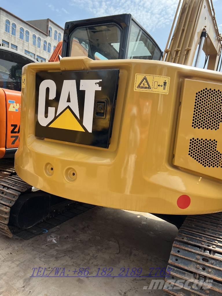 CAT 310 Telakaivukoneet