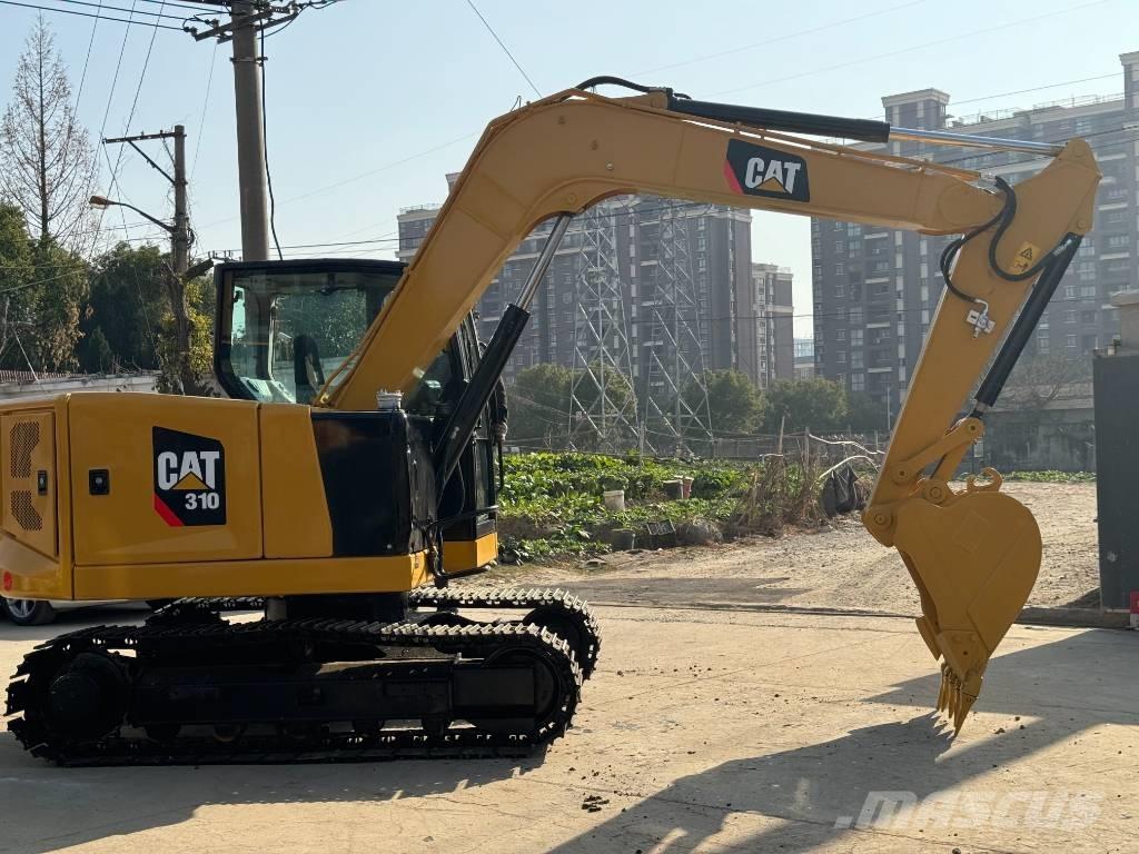 CAT 310 Telakaivukoneet