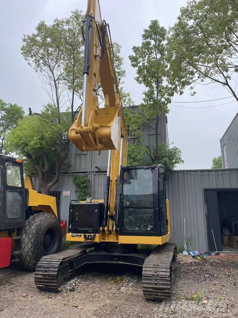 CAT 310 Telakaivukoneet