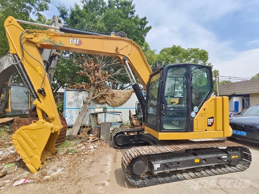 CAT 310 Telakaivukoneet