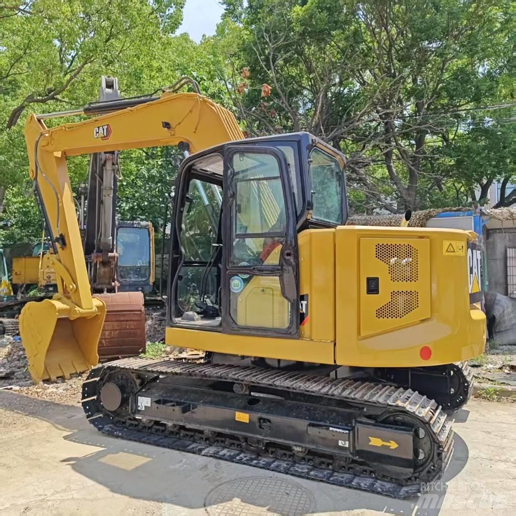 CAT 310 Telakaivukoneet