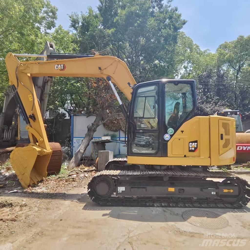 CAT 310 Telakaivukoneet