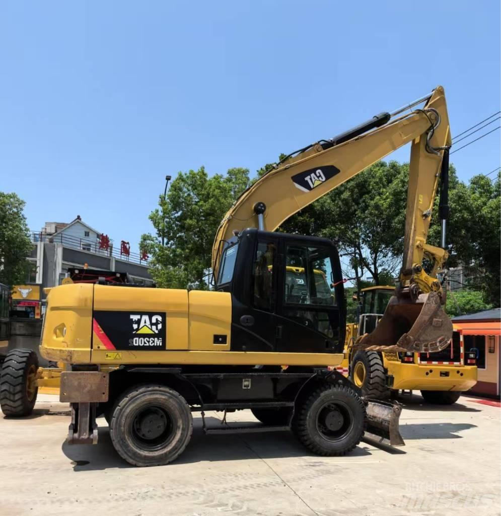 CAT M 320 Pyöräkaivukoneet