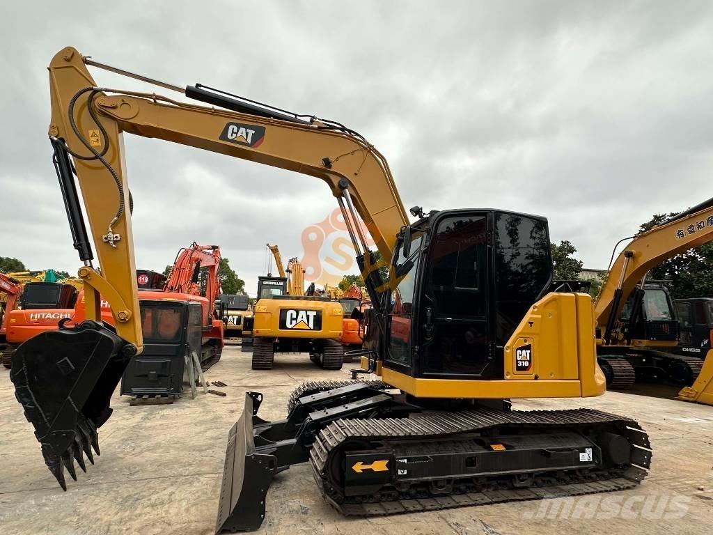 CAT 310 Telakaivukoneet