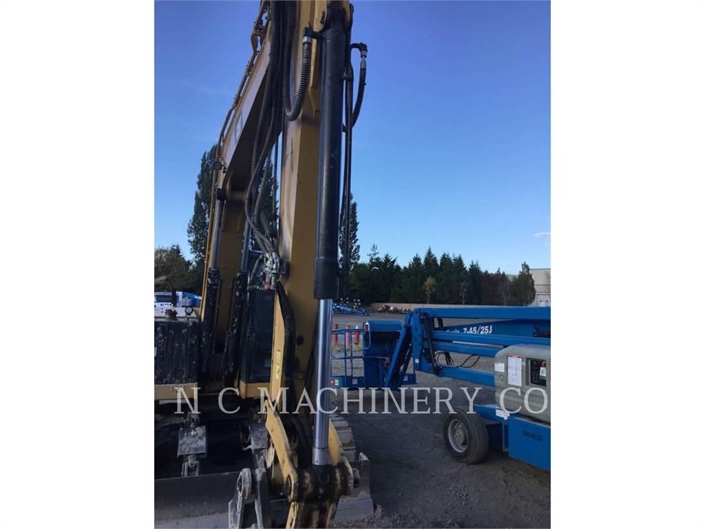 CAT 310 Telakaivukoneet
