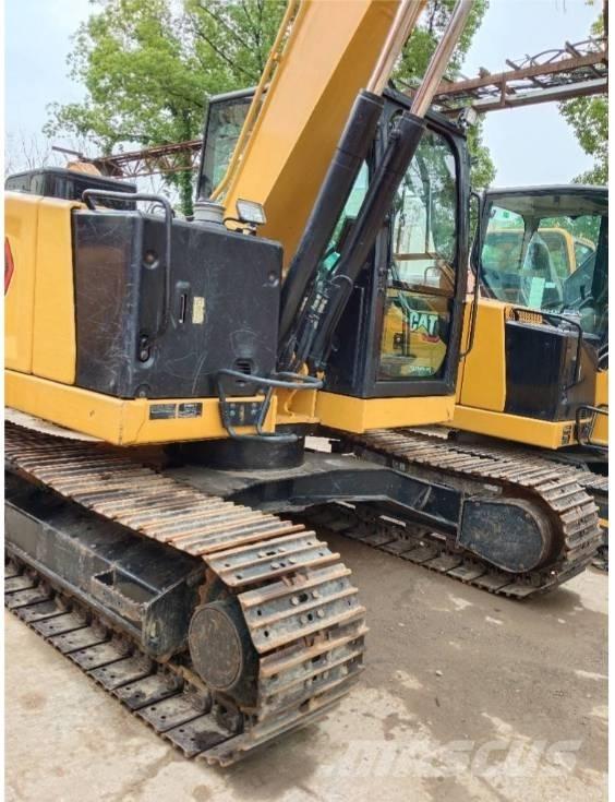 CAT 310 Telakaivukoneet
