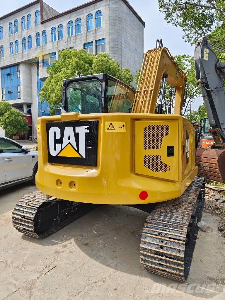 CAT 310 Telakaivukoneet