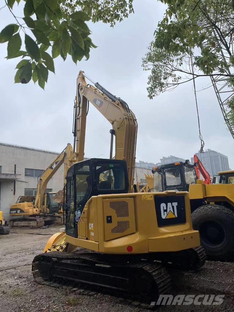 CAT 310 Telakaivukoneet