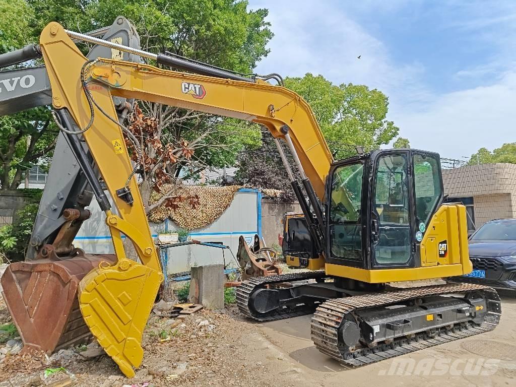 CAT 310 Telakaivukoneet