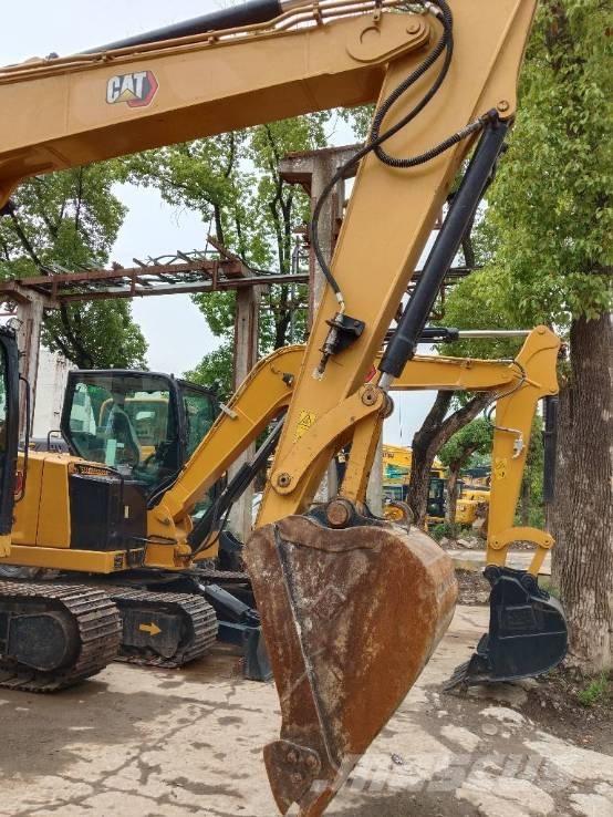 CAT 310 Telakaivukoneet