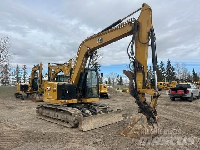 CAT 310 Telakaivukoneet