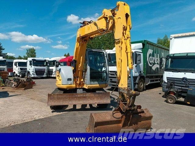 New Holland E70SR 4 Kaivurikuormaajat