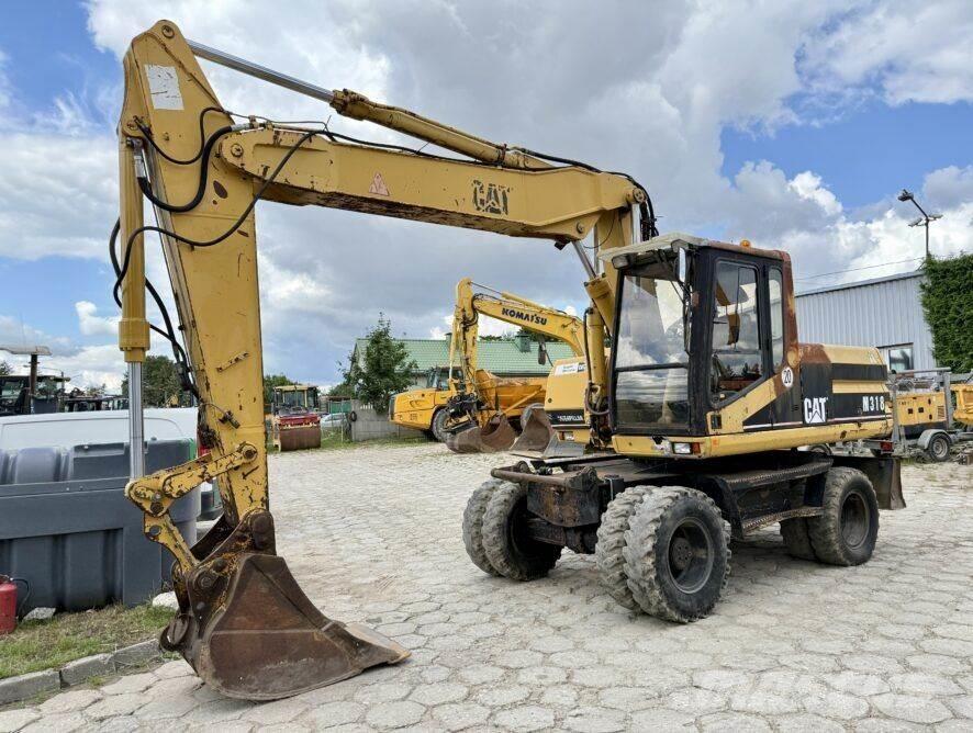 CAT M318 Pyöräkaivukoneet