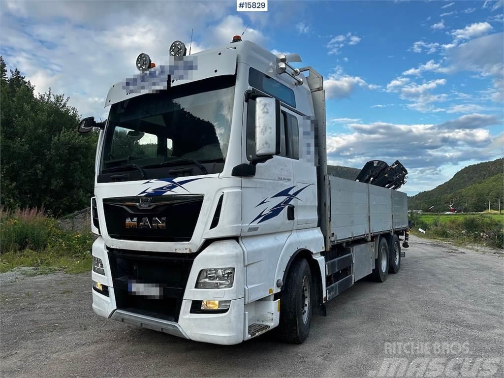 MAN TGX 26.560 Flatbed truck with Hiab 138 crane from  Lava-kuorma-autot